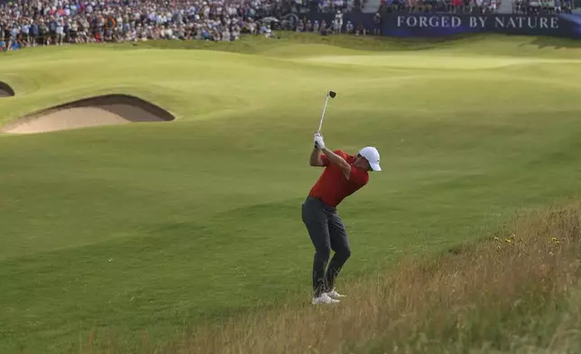 Rory McIlroy of Northern Ireland chips onto the 9th green during the third round of the British Open golf championship at the Royal Portrush Golf Club, Northern Ireland, Saturday, July 19, 2025. (AP Photo/Peter Morrison)