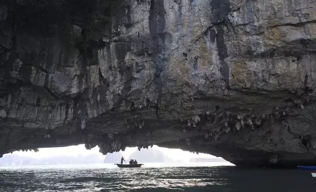 FILE - Houses float in a fishing village in Ha Long Bay in Vietnam on July 2, 2025. (AP Photo/ Huy Han)