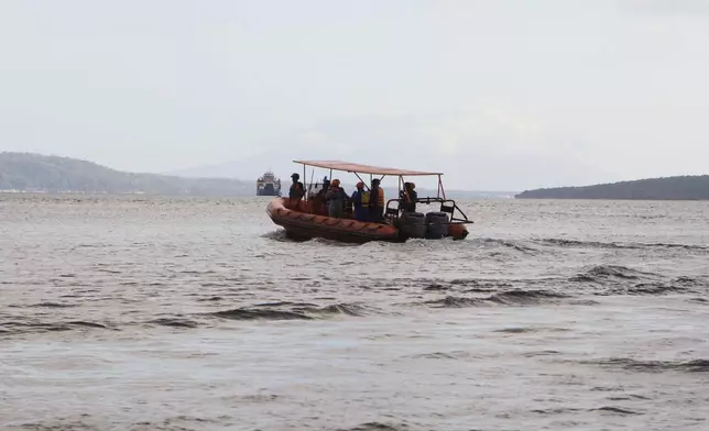 Rescuers search for victims after a ferry sank in the waters off Jembrana, Bali, Indonesia, Friday, July 4, 2025. (AP Photo/Firdia Lisnawati)