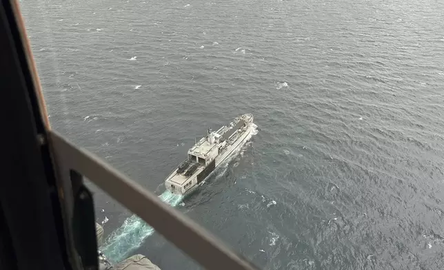 Indonesian Navy ship KRI Teluk Ende cruises the Straits of Bali during a search operation for the victims of a late Wednesday ferry sinking near Bali, Indonesia, Friday, July 4, 2025. (AP Photo/Firdia Lisnawati)