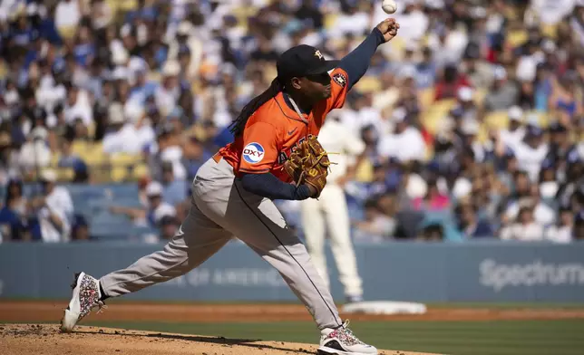 Houston Astros starting pitcher Framber Valdez delivers during the first inning of a baseball game against the Los Angeles Dodgers in Los Angeles, Saturday, July 5, 2025. (AP Photo/Kyusung Gong)