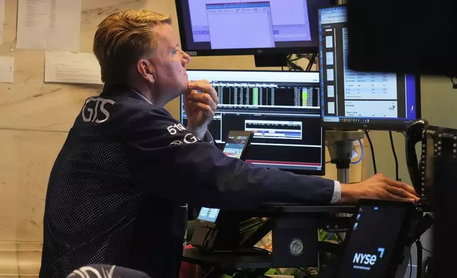 Trader John Bowers works on the floor of the New York Stock Exchange, Tuesday, July 8, 2025. (AP Photo/Richard Drew)