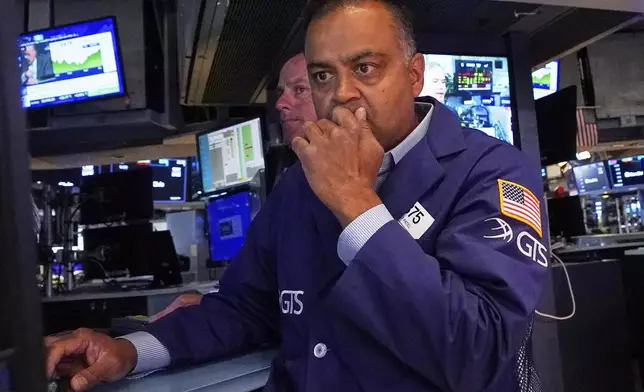 Specialist Dilip Patel works on the floor of the New York Stock Exchange, Tuesday, July 8, 2025. (AP Photo/Richard Drew)