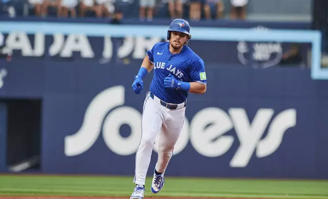 Toronto Blue Jays' Addison Barger (47) rounds the bases after hitting a three-run home run during the first inning of a baseball game against the New York Yankees in Toronto, Wednesday, July 2, 2025. (Sammy Kogan/The Canadian Press via AP)