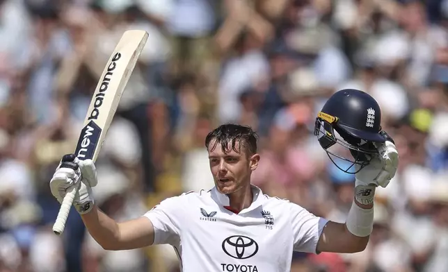 England's Jamie Smith celebrates after scoring a century on day three of the second cricket test match between England and India at Edgbaston in Birmingham, England, Friday, July 4, 2025. (AP Photo/Scott Heppell)