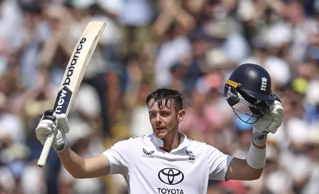 England's Jamie Smith celebrates after scoring a century on day three of the second cricket test match between England and India at Edgbaston in Birmingham, England, Friday, July 4, 2025. (AP Photo/Scott Heppell)