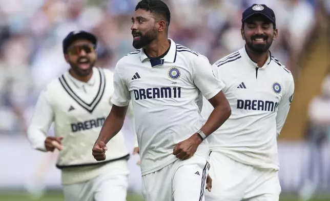 India's Mohammed Siraj, center, celebrates after the dismissal of England captain Ben Stokes on day three of the second cricket test match between England and India at Edgbaston in Birmingham, England, Friday, July 4, 2025. (AP Photo/Scott Heppell)