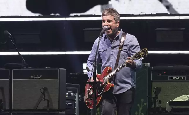 Noel Gallagher from the band Oasis performs during their reunion concert on Friday, July 4, 2025, in Cardiff. (Photo by Scott A Garfitt/Invision/AP)