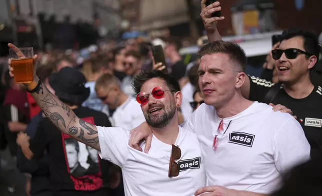 Fans gather for the Oasis reunion concert on Friday, July 4, 2025, in Cardiff. (Photo by Scott A Garfitt/Invision/AP)