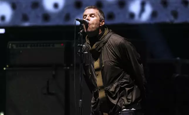 Liam Gallagher from the band Oasis performs during their reunion concert on Friday, July 4, 2025, in Cardiff. (Photo by Scott A Garfitt/Invision/AP)