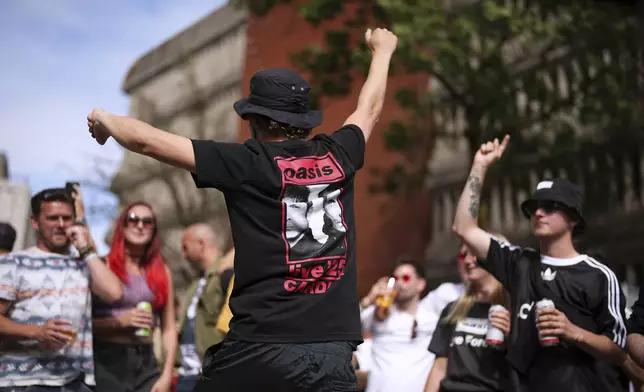 Fans gather for the Oasis reunion concert on Friday, July 4, 2025, in Cardiff. (Photo by Scott A Garfitt/Invision/AP)