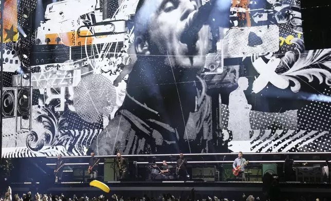 Oasis perform during their reunion concert on Friday, July 4, 2025, in Cardiff. (Photo by Scott A Garfitt/Invision/AP)