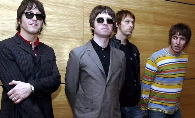 FILE - Members of British rock band Oasis pose for photos ahead of a concert in Hong Kong, Feb. 25, 2006. From left are, Gem Archer, Noel Gallagher, Andy Bell, and Liam Gallagher. (AP Photo/Lo Sai Hung)