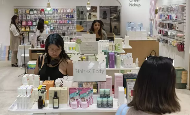 Customers check out Asian beauty products at Senti Senti in New York on Friday, July 25, 2025. (AP Photo/Yuki Iwamura)