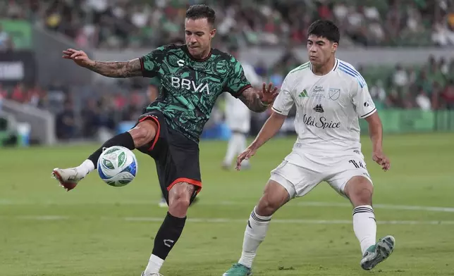 Liga MX All-Stars' Gustavo Ferraris, left, moves the ball past MLS All-Stars' Obed Vargas, right, during the MLS All-Star soccer match in Austin, Texas, Wednesday, July 23, 2025. (AP Photo/Eric Gay)