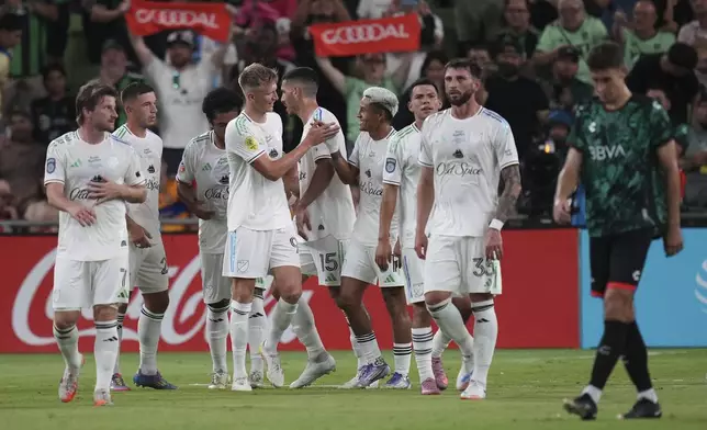 MLS All-Stars' Sam Surridge, center, celebrates with teammates after his goal against Liga MX All-Stars during the MLS All-Star soccer match in Austin, Texas, Wednesday, July 23, 2025. (AP Photo/Eric Gay)
