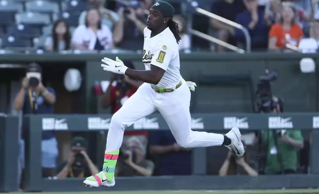 Athletics' Lawrence Butler sprints toward home plate as he hits an inside-the-park home run against the Atlanta Braves during the first inning of a baseball game Tuesday, July 8, 2025, in West Sacramento, Calif. (AP Photo/Scott Marshall)