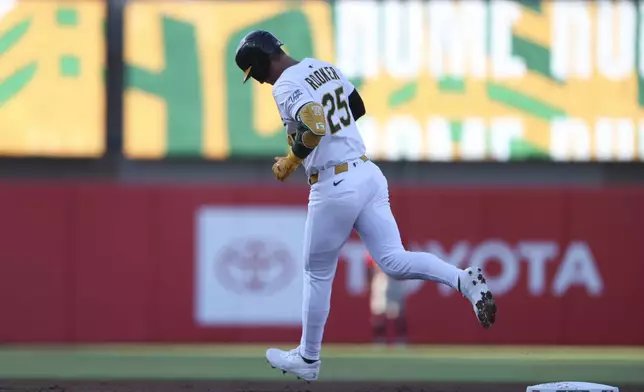 Athletics' Brent Rooker jogs around the bases after hitting a two-run home run against the Atlanta Braves during the first inning of a baseball game Tuesday, July 8, 2025, in West Sacramento, Calif. (AP Photo/Scott Marshall)