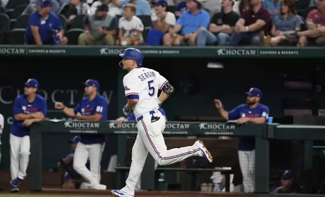 Texas Rangers' Corey Seager sprints around the bags after hitting a solo home run in the third inning of a baseball game against the Athletics, Wednesday, July 23, 2025, in Arlington, Texas. (AP Photo/Tony Gutierrez)
