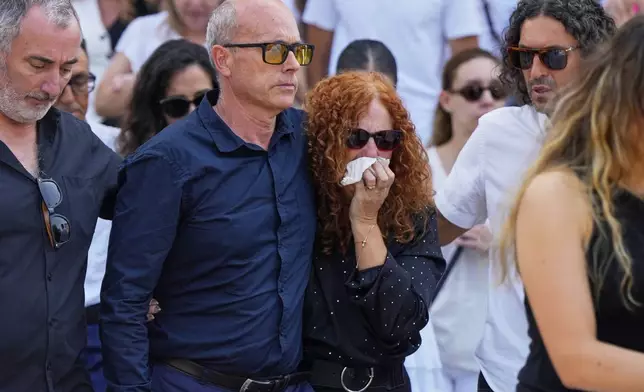 Diogo Jota's parents Joaquim and Isabel, reacts next to the coffin of their sons, during their funeral in Gondomar, near Porto, Portugal, on Saturday, July 5, 2025. (AP Photo/Manu Fernandez)