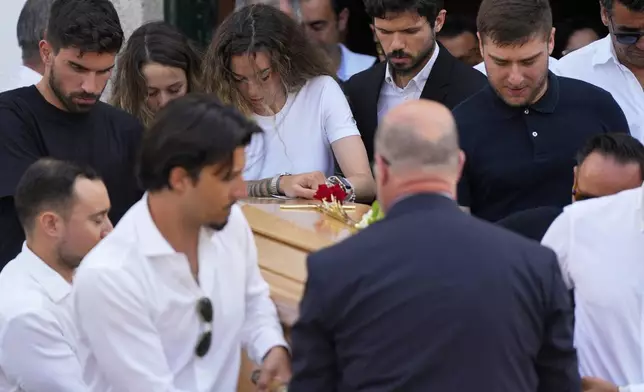 Diogo Jota's wife Rute Cardoso reacts next to the coffin of his husband, during his funeral in Gondomar, near Porto, Portugal, on Saturday, July 5, 2025. (AP Photo/Manu Fernandez)