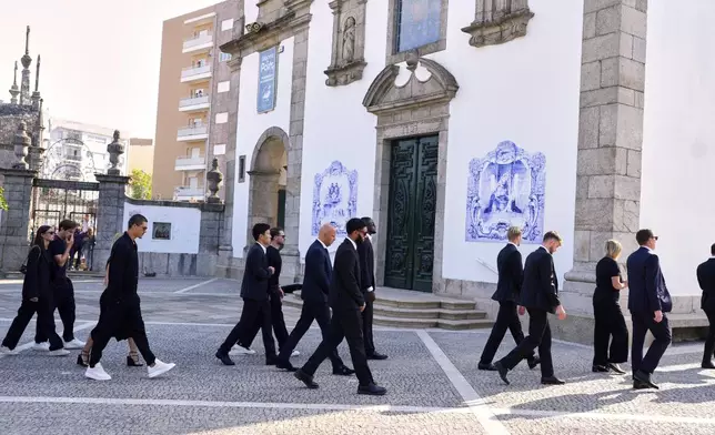 Liverpool players walk to the church to attend the funeral of their teammate Diogo Jota and his brother André Silva, in Gondomar, near Porto, Portugal, on Saturday, July 5, 2025. (AP Photo/Manu Fernandez)