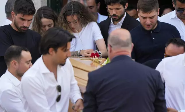 Diogo Jota's wife Rute Cardoso reacts next to the coffin of his husband, during his funeral in Gondomar, near Porto, Portugal, on Saturday, July 5, 2025. (AP Photo/Manu Fernandez)