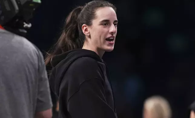Indiana Fever's Caitlin Clark talks to fans before a WNBA basketball game against the New York Liberty Wednesday, July 16, 2025, in New York. (AP Photo/Frank Franklin II)