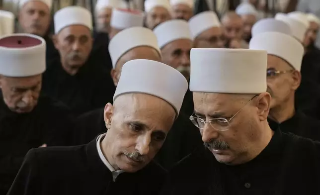 Druze clerics take part in a gathering of minority religious leaders in Beirut, Lebanon, Friday, July 18, 2025, as they speak about sectarian clashes between Druze factions, Sunni Muslim Bedouin clans, and government forces in Syria. (AP Photo/Bilal Hussein)