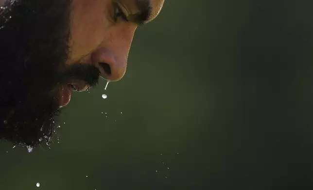 Seattle Seahawks offensive tackle Abraham Lucas looks down during the NFL football team's training camp in Renton, Wash. (AP Photo/Lindsey Wasson)