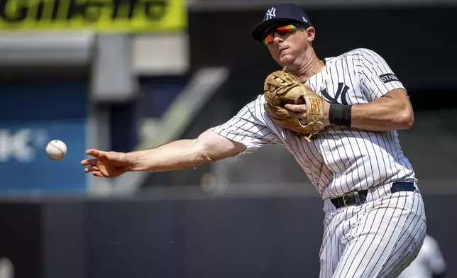 New York Yankees second base DJ LeMahieu (26) grounds out Athletics' Max Muncy (10) during the sixth inning of a baseball game, Saturday, June 28, 2025, in New York. (AP Photo/Angelina Katsanis)