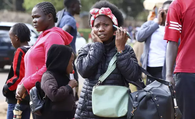 A woman talks on her mobile phone in downtown Nairobi, Kenya, Sept. 13, 2025. (AP Photo/Andrew Kasuku)