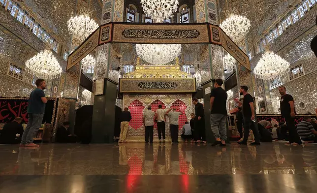 Shiite worshippers pray at the shrine of al-Sayydah Zeinab, the grand daughter of Prophet Mohammed, where they attend Ashoura ritual, south of Damascus, Syria, Thursday, July 3, 2025. (AP Photo/Omar Sanadiki)