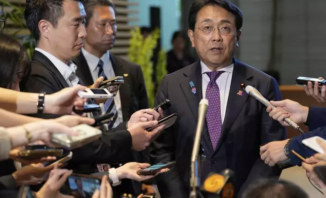 Japan's chief tariff negotiator Ryosei Akazawa speaks to the media after a meeting between Japanese Prime Minister Shigeru Ishiba and U.S. Treasury Secretary Scott Bessent at the prime minister's office in Tokyo, Japan, Friday, July 18, 2025.(AP Photo/Shuji Kajiyama, Pool)