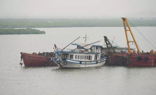 Tourist boat Wonder Sea is towed to a shipyard for investigation after its capsizing, which killed multiple people, in a thunderstorm in Ha Long Bay, Vietnam Sunday, July 20, 2025. (AP Photo/Huy Han)