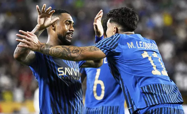 Al-Hilal's Malcom is congratulated by Al-Hilal's Marcos Leonardo after scoring his teams second goal during the Club World Cup round of 16 soccer match between Manchester City and Al Hilal in Orlando, Fla., Monday, June 30, 2025. (AP Photo/Phelan Ebenhack)