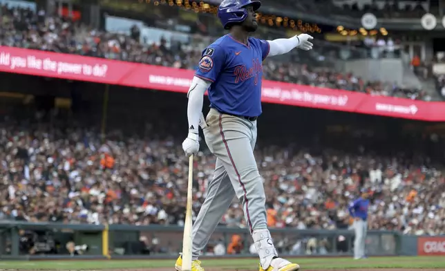 New York Mets' Ronny Mauricio reacts after his solo home run against the San Francisco Giants during the seventh inning of a baseball game in San Francisco, Sunday, July 27, 2025. (AP Photo/Jed Jacobsohn)