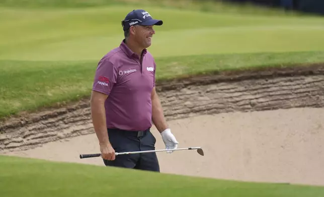 Pidgin Harrington of Ireland looks to play out of a bunker on the 13th green during a practice round for the British Open golf championship at the Royal Portrush Golf Club, Northern Ireland, Tuesday, July 15, 2025. (AP Photo/Jon Super)