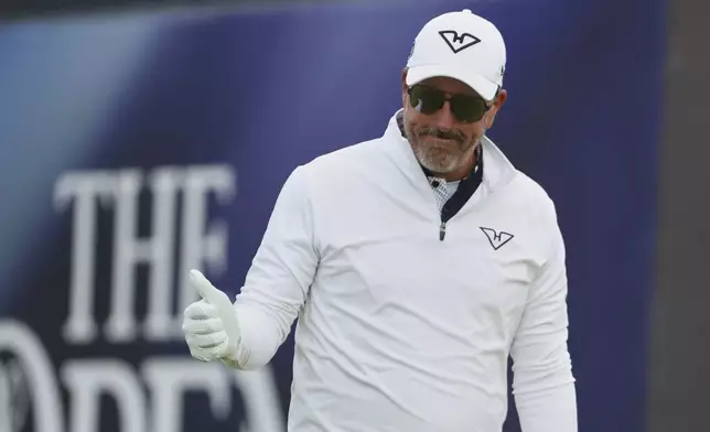Phil Mickelson of the United States acknowledges the crowd as he walks off the 1st tee after playing his shot during the first round of the British Open golf championship at the Royal Portrush Golf Club, Northern Ireland, Thursday, July 17, 2025. (AP Photo/Peter Morrison)
