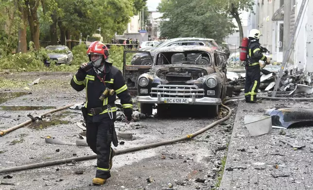 Firefighters work at the site of Russian air attack in Lviv, Ukraine, Saturday, July 12, 2025. (AP Photo/Mykola Tys)