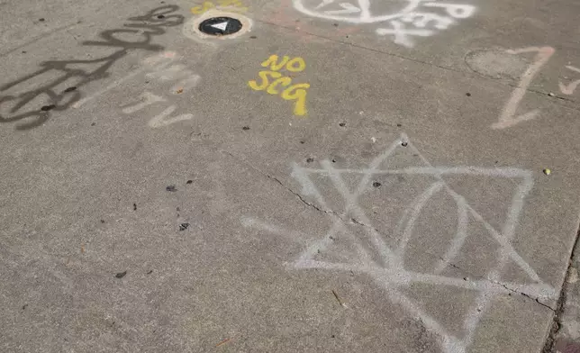 Graffiti is seen on the ground near the Islamic Center of Southern California on June 16, 2025, in Los Angeles. (AP Photo/Jessie Alcheh)