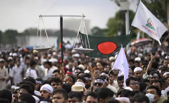 Thousands of supporters of Bangladesh's largest Islamist party Jamaat-e-Islami attend a rally in a show of strength ahead of elections expected next year, in Dhaka, Bangladesh, Saturday, July 19, 2025. (AP Photo/Mahmud Hossain Opu)