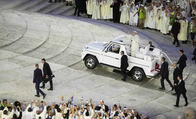 Pope Leo XIV greets faithful in St. Peter's Square at the end of a welcome mass for the Youth Jubilee at the Vatican, Tuesday, July 29, 2025. (AP Photo/Gregorio Borgia)