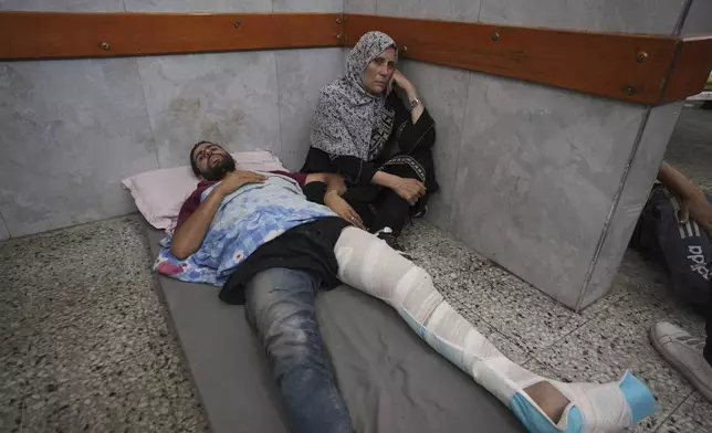 Mahmoud Al-Hosary is brought to Shifa Hospital in Gaza City after being injured on his way to an aid distribution center, Thursday, July 3, 2025. (AP Photo/Jehad Alshrafi)