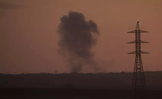 Smoke from an Israeli bombardment rises over the Gaza Strip, seen from southern Israel, Wednesday, July 2, 2025. (AP Photo/Ohad Zwigenberg)