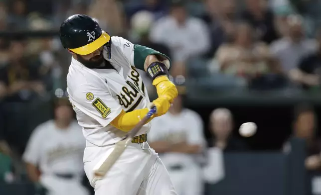 Athletics' Shea Langeliers hits a one run home run during the fifth inning of a baseball game against the Seattle Mariners Tuesday, July 29, 2025, in West Sacramento, Calif. (AP Photo/Sergio Estrada)