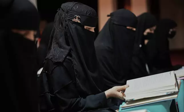 Afghan girls attend a religious studies class at an religious education center in Kabul, Afghanistan, Wednesday, May 28, 2025. (AP Photo/Ebrahim Noroozi)