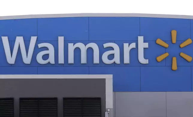 FILE - A Walmart logo is displayed outside of a Walmart store, in Walpole, Mass., Sept. 3, 2019. (AP Photo/Steven Senne, File)