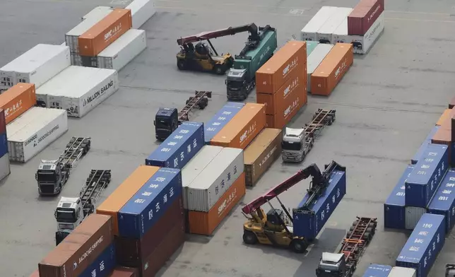 Cranes and shipping containers are seen at a port in Pyeongtaek, South Korea, Tuesday, July 8, 2025. (AP Photo/Ahn Young-joon)
