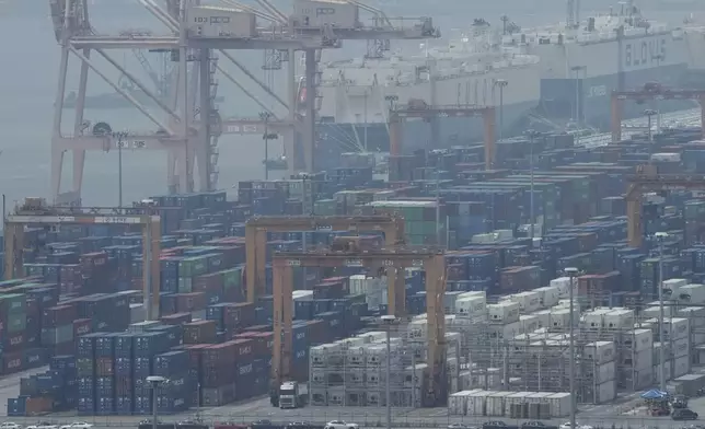 Cranes and shipping containers are seen at a port in Pyeongtaek, South Korea, Tuesday, July 8, 2025. (AP Photo/Ahn Young-joon)